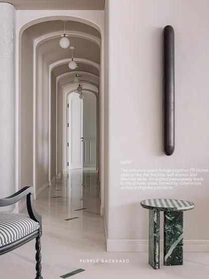 An arched hallway from one of our projects, featured in Livingetc India. The custom green marble side table is a PB Home object that brings together the full story of our design and production process.