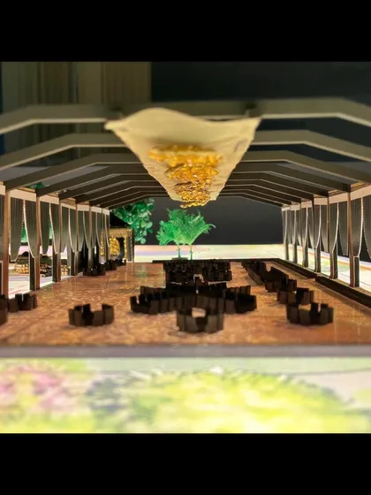 A view through a miniature version of a large tented structure. This model helps me plan the seating arrangement and the flow of the space long before any construction begins.