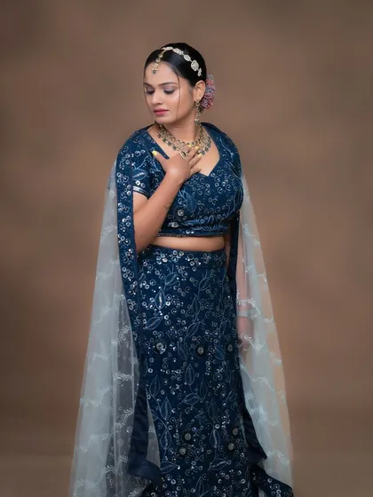 The full look, showing how the jewellery adds a touch of elegance to the modern lehenga.