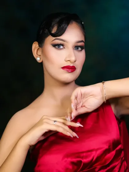 This pose highlights the flawless skin and the vintage-inspired finger wave hairstyle. I teach both makeup and hair to ensure you can create a complete, cohesive look.