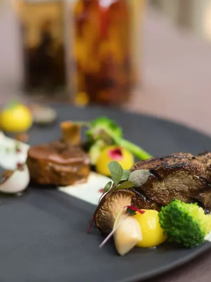 The Duo of Lamb is a showcase of textures and flavors, featuring different cuts of lamb prepared to perfection.