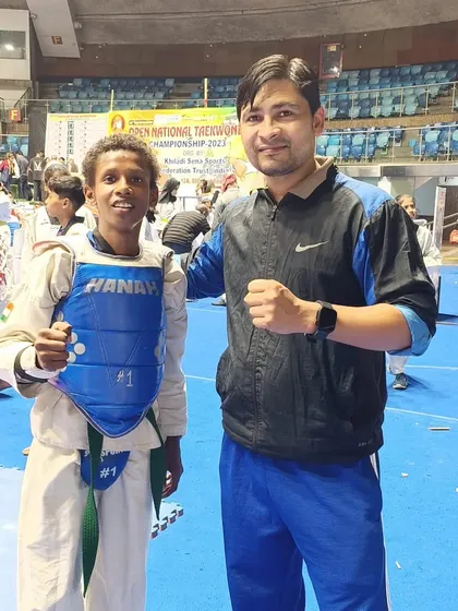 Posing with a student in his sparring gear after a good fight.