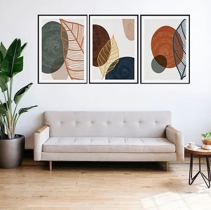 This set of three framed prints showcases unique botanical art against abstract backgrounds. The earthy color palette and mix of textures create a warm, inviting, and artistic wall display.
