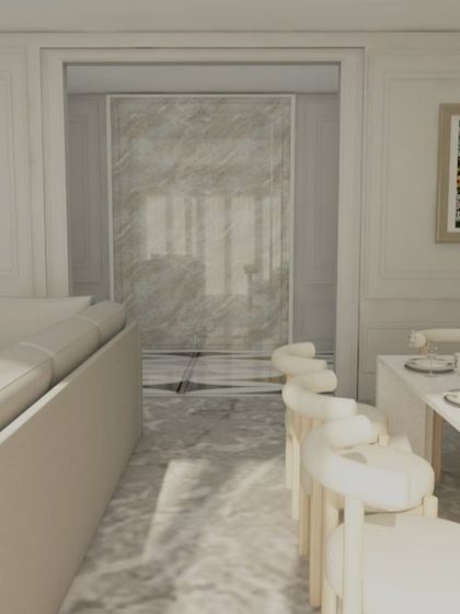 A view from the dining area towards the living room, showing the cohesive design of the entire space.