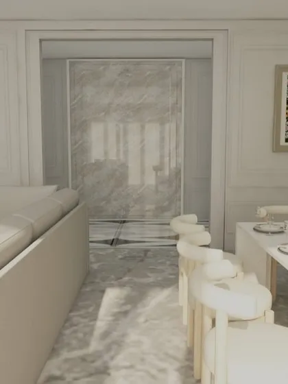 A view from the dining area towards the living room, showing the cohesive design of the entire space.