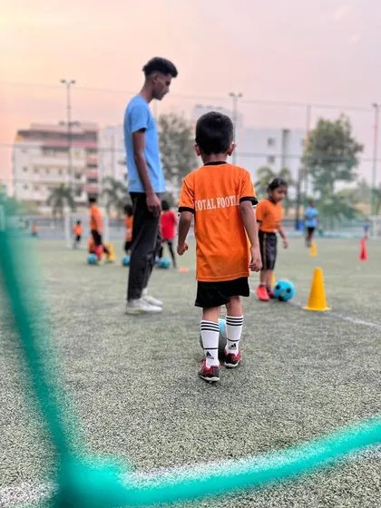 A young player looks back at the coach, ready for the next instruction in our grassroots training session.