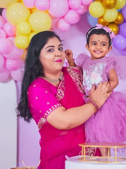 A heartwarming close-up of mother and daughter, capturing a moment of affection and a happy smile.