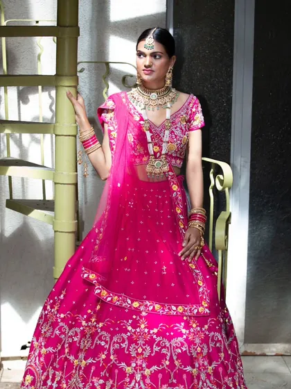 For this designer bridal lookbook, I focused on the vibrant color and intricate embroidery of the lehenga. The studio setting with the spiral staircase adds a unique architectural element to this fashion portrait, making the garment stand out.