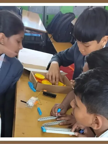 Teamwork makes the dream work. Here, a group of students unboxes a kit and begins to assemble their project together, learning from each other as they go.