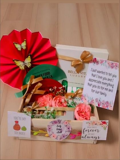 A pamper hamper perfect for a birthday or just because. It includes a Bella Vita luxury face mask, macarons, and other self-care goodies arranged in a beautiful tray.