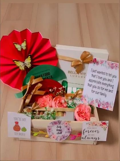 A pamper hamper perfect for a birthday or just because. It includes a Bella Vita luxury face mask, macarons, and other self-care goodies arranged in a beautiful tray.