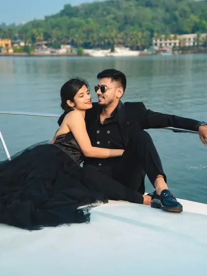 Your love story deserves an adventure. We plan exclusive destination photoshoots, like this luxury yacht session in Goa, to capture your bond against stunning sea views for a truly glamorous experience.