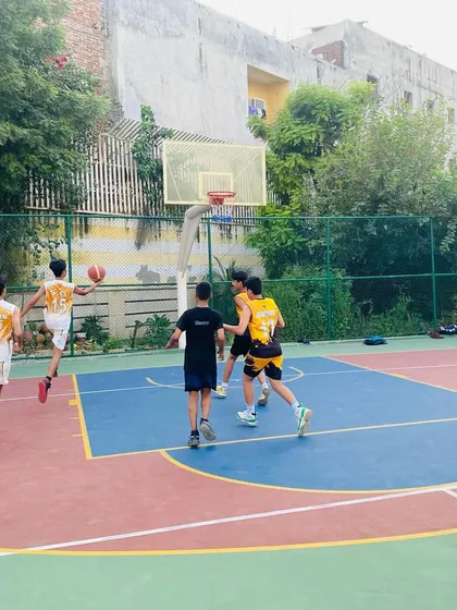 A player drives to the basket for a layup.