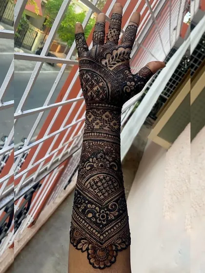 Another view of the full-arm bridal design from ID 42, showing the consistency and detail of the pattern as it wraps around the arm.
