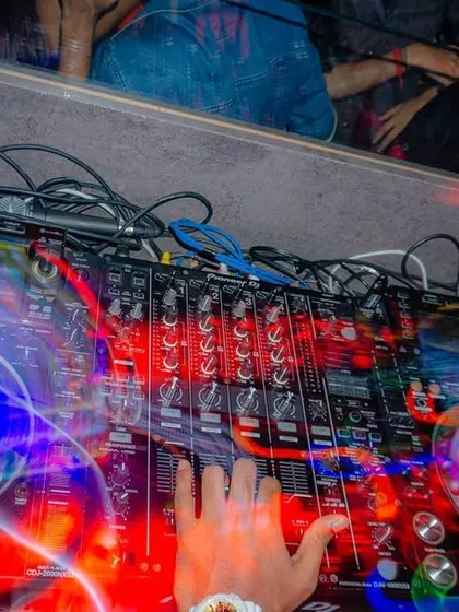 A long exposure shot capturing the motion and precision of my hands on the decks. This is where I add live scratching and effects to elevate the tracks.