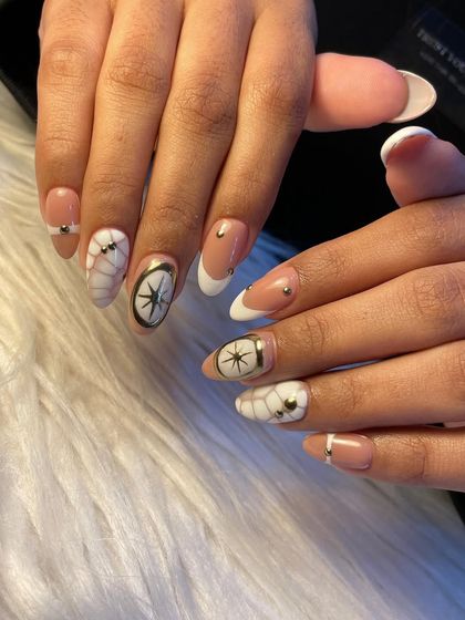 Animal prints are always in style, and this white croc design is a chic and modern interpretation. Paired with a French tip and gold accents, it's the perfect nail art for a stylish vacation.