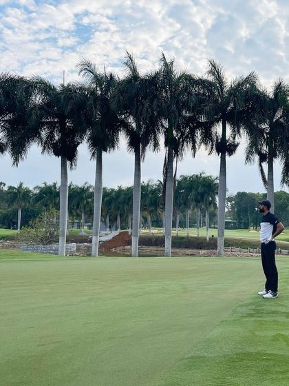 Surveying the green from the fairway, a key part of course management. I teach my students how to assess the landscape and plan their approach shots for the best possible outcome.