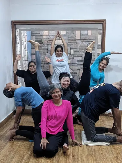 Our yoga community is all about connection and fun. This playful group pose captures the supportive and happy energy we create together in the studio. Happy New Year to my wonderful yoga family.