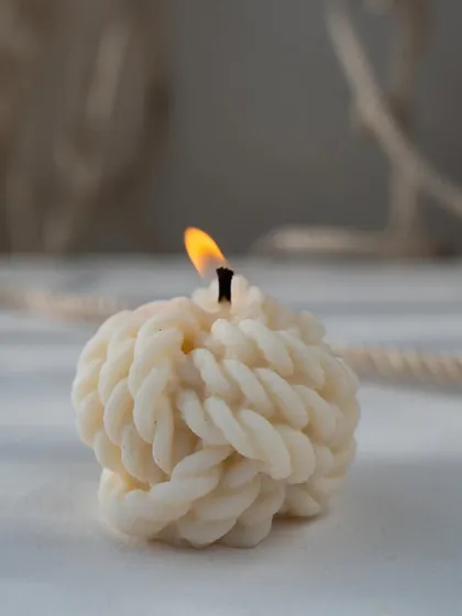 Who doesn't love a cute little braid candle? This structural candle is all about texture and unique shape.