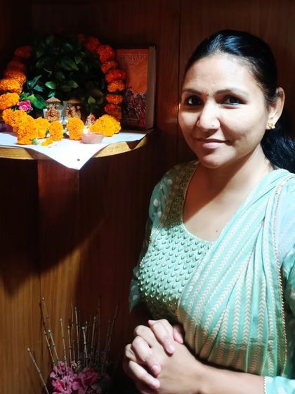 A colleague at the office shrine during Diwali.