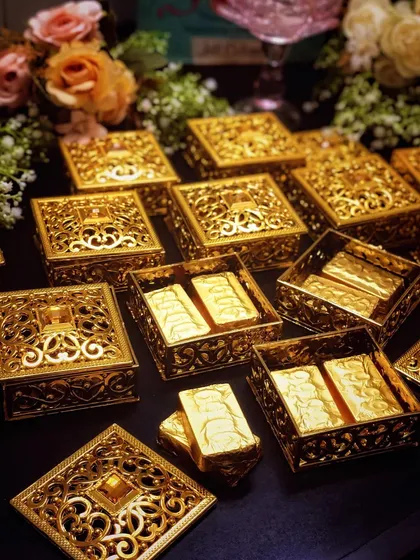 For Diwali, I offer luxurious corporate gifting solutions that feel personal and look exquisite. These ornate golden filigree boxes contain premium chocolate bars, making for an elegant and memorable gift for clients and employees.