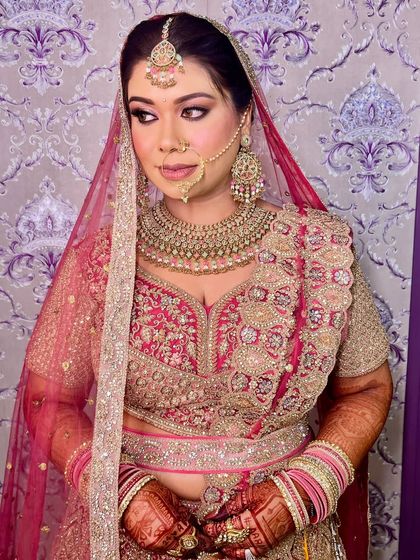 A side profile of our stunning bride. The makeup is perfectly blended to look seamless from every angle, highlighting her features beautifully.