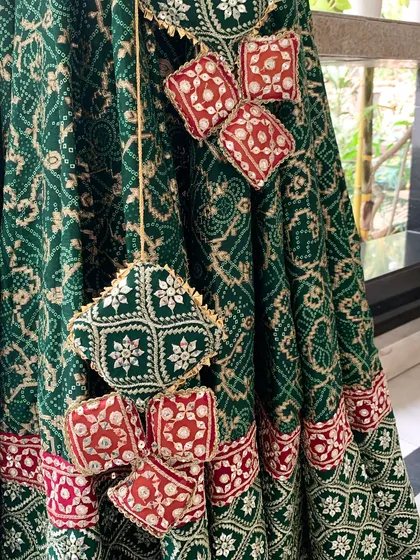 A close-up of the beautiful, handcrafted tassels on the lehenga skirt.