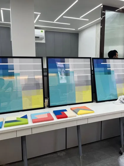 Three large, framed geometric pixel-art pieces ready for an office, designed to add a modern, tech-inspired feel to the decor.