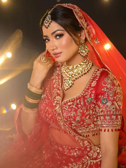 This look is all about a classic red lehenga with a contemporary edge. I balanced the traditional outfit with minimal, glowing makeup for a stunning and natural finish.