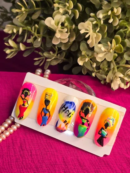 Another angle of the stunning African art-themed nail set, showcasing the intricate details and bold color combinations.