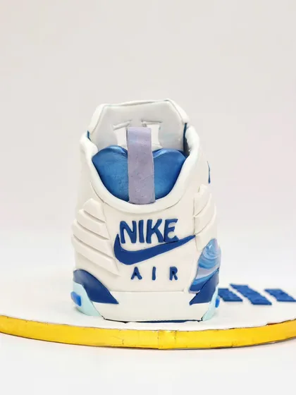 The back of the sneaker cake, featuring the iconic "Nike Air" logo, all done by hand with fondant.
