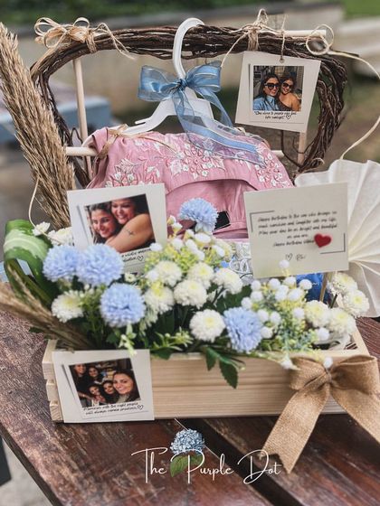 The full view of the bespoke birthday hamper, showcasing how I integrate client-provided gifts like clothing into a cohesive and elegant presentation.
