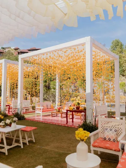 A wider view of the 'Haldi Holi' lounges, showing how the yellow tassels defined the space.