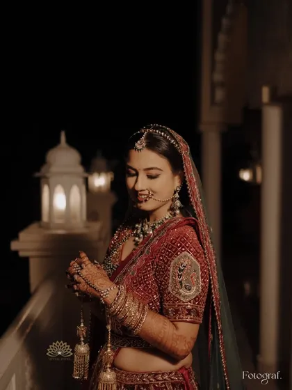 A beautiful, serene portrait of the bride. Her hands, covered in my intricate mehndi, are held gracefully, completing her stunning bridal look.