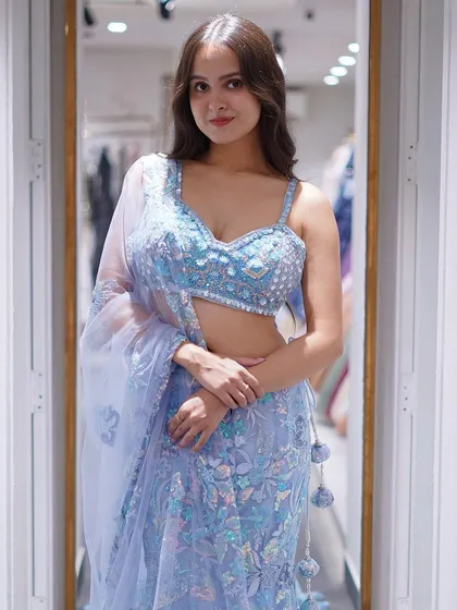 Dive into the magic of the night sky with this celestial blue fishtail lehenga, shimmering like stars.
