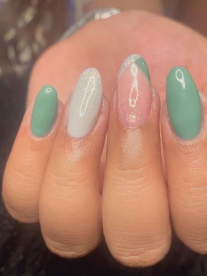 A close-up of the sage green French manicure, showing the different finishes on each nail.