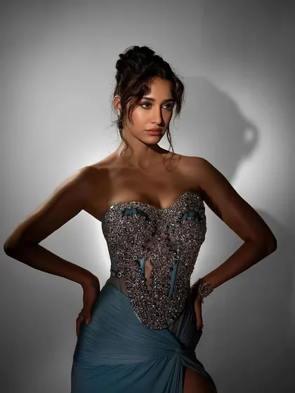 A dramatic, high-contrast makeup look for Disha Patani's feature in ELLE India. The sculpted updo and smoky eyes were designed to create a sense of modern elegance and drama.