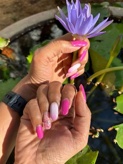 Festive nails ready for a family wedding. This client chose a fun combination of vibrant pink, a soft ombré, and a touch of glitter for a celebratory look.