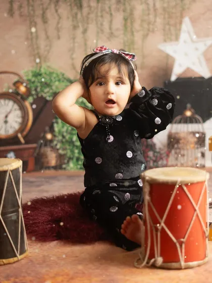 A funny and candid moment from the birthday shoot. These unpredictable expressions are what make milestone sessions so memorable.