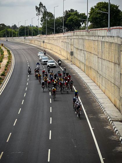 The peloton from an aerial perspective, showing the race from a unique and dynamic angle.