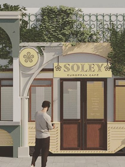 A conceptual illustration of the Soley Cafe entrance, focusing on the tram car element and signage.