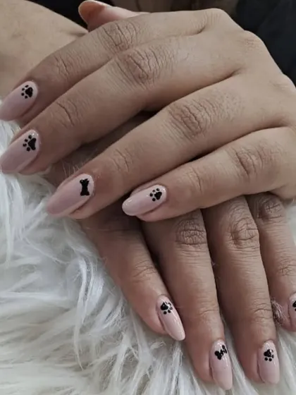 For all the dog lovers, this cute set features a neutral pink base with delicate black paw print and bone designs.