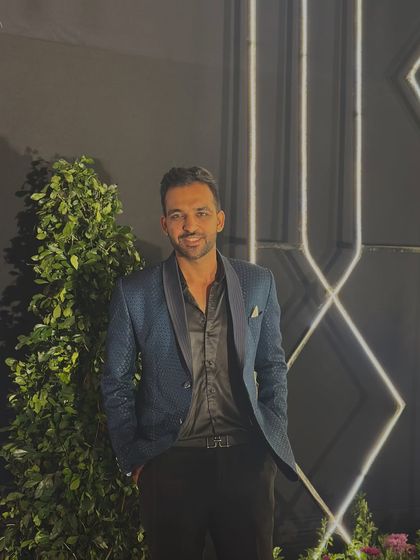 A smile before the show begins. I believe in bringing a positive and approachable energy to every event I host.