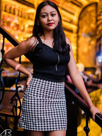 A guest posing on the stairs.
