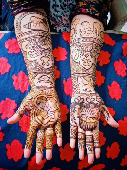 The complete view of the front-side of the baby shower story mehandi, showing how all the different portraits and motifs come together.