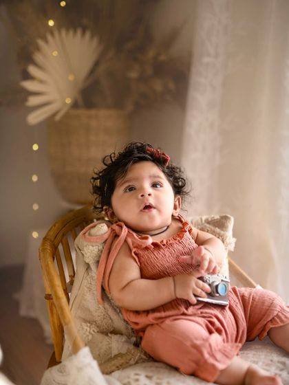 This little explorer is holding a vintage camera prop during her five-month session. I love incorporating fun elements that match the theme of the shoot.