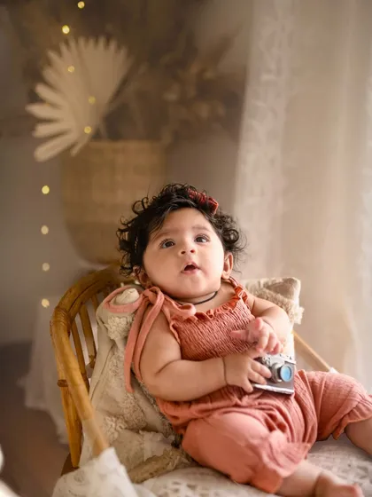 This little explorer is holding a vintage camera prop during her five-month session. I love incorporating fun elements that match the theme of the shoot.
