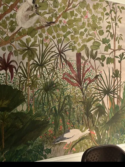 This expansive jungle scene, complete with a perched stork and a curious lemur, transforms a dining area into an exotic escape. Our murals are designed to be immersive, combining form and function to create stunning spaces.