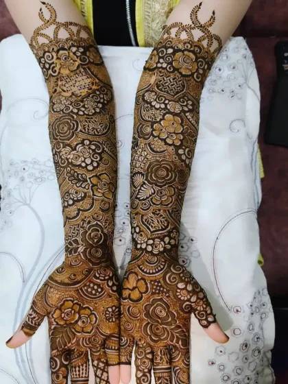 This full coverage bridal mehndi is a great example of how I blend different elements, from checkered patterns to blooming roses, into one cohesive design.