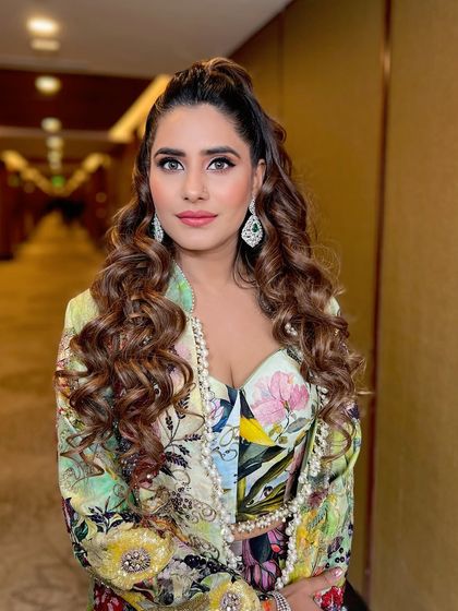 A close-up portrait, her happiness and beautiful makeup shining through.